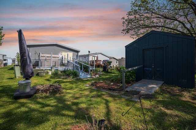 yard at dusk with a storage unit