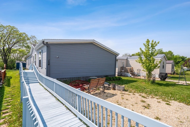 rear view of property with a lawn