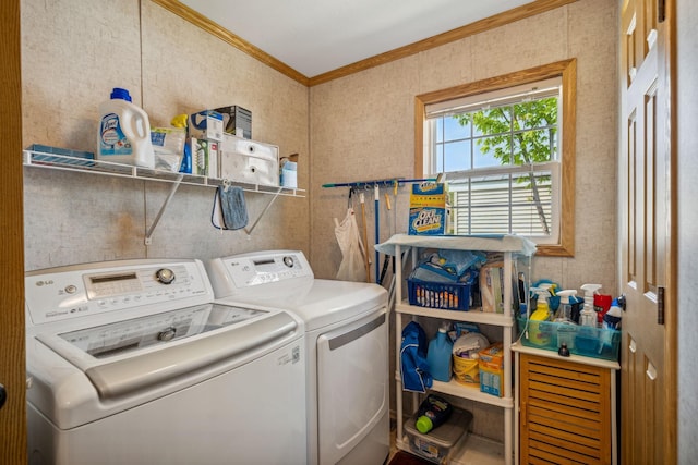 washroom with separate washer and dryer and crown molding