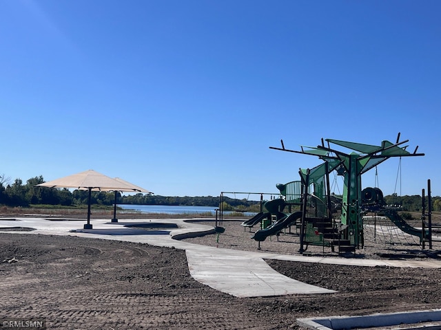 view of playground featuring a water view