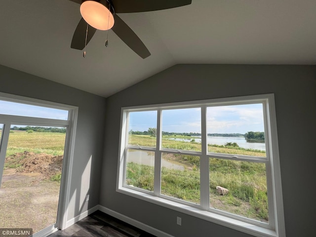 room details featuring a water view and ceiling fan