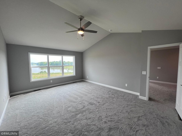 unfurnished room with carpet floors, lofted ceiling, and ceiling fan