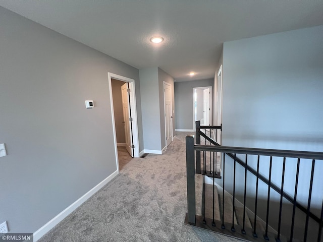 corridor with light carpet