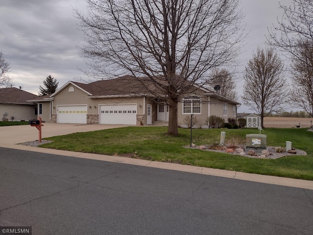 ranch-style home featuring a front yard and a garage