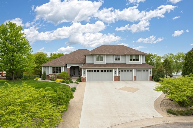 view of front facade with a garage and a front lawn