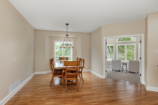 dining area featuring light wood-type flooring