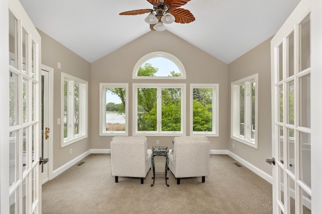 sunroom with french doors, ceiling fan, and lofted ceiling