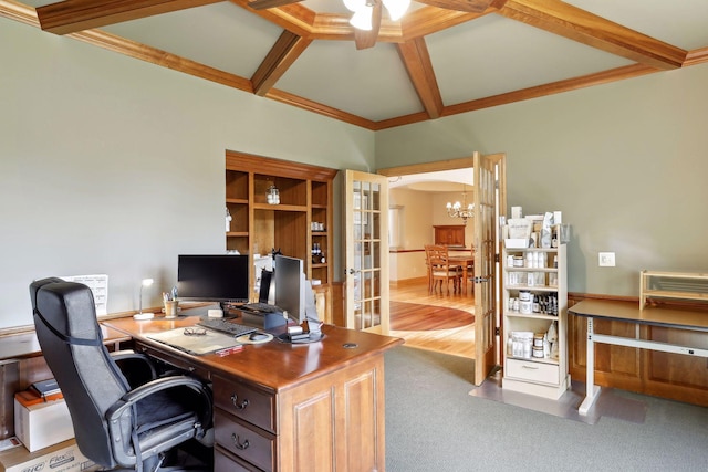 office with coffered ceiling, ceiling fan with notable chandelier, crown molding, hardwood / wood-style flooring, and beamed ceiling