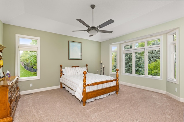 bedroom featuring ceiling fan and light colored carpet