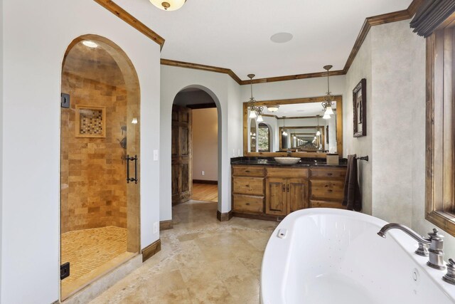 bathroom featuring vanity, ornamental molding, and plus walk in shower