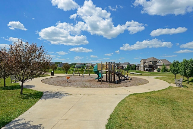 view of jungle gym featuring a lawn