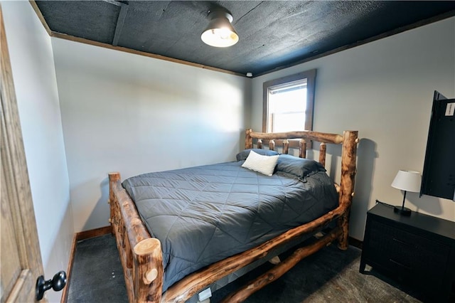 bedroom featuring dark carpet