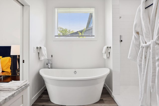 bathroom featuring separate shower and tub, vanity, and hardwood / wood-style flooring