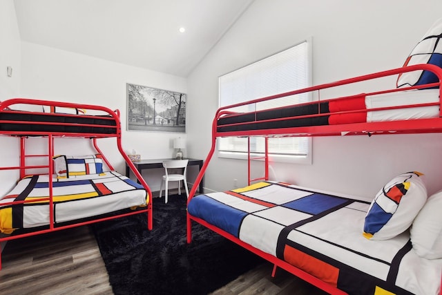 bedroom featuring hardwood / wood-style floors and lofted ceiling