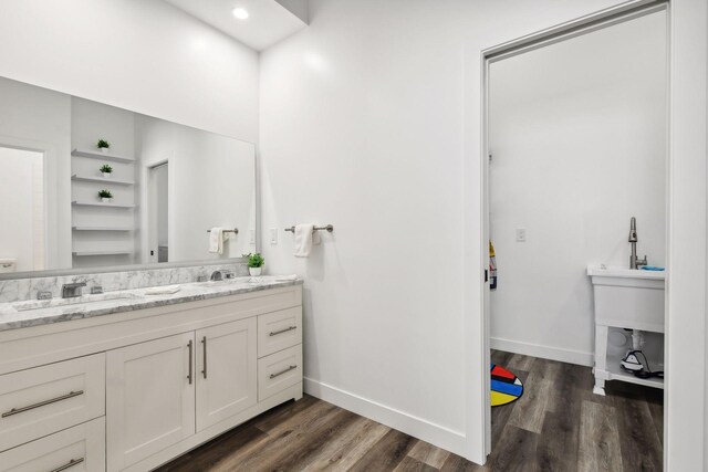 bathroom with vanity and hardwood / wood-style flooring