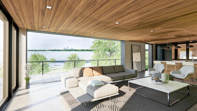 living room with wooden ceiling, a wall of windows, and a water view