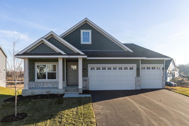 view of front facade with a garage and covered porch