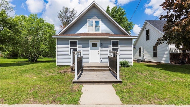 bungalow-style home featuring a front lawn