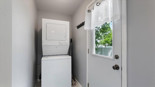 laundry room featuring stacked washer and dryer