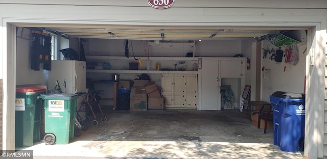 garage featuring white fridge