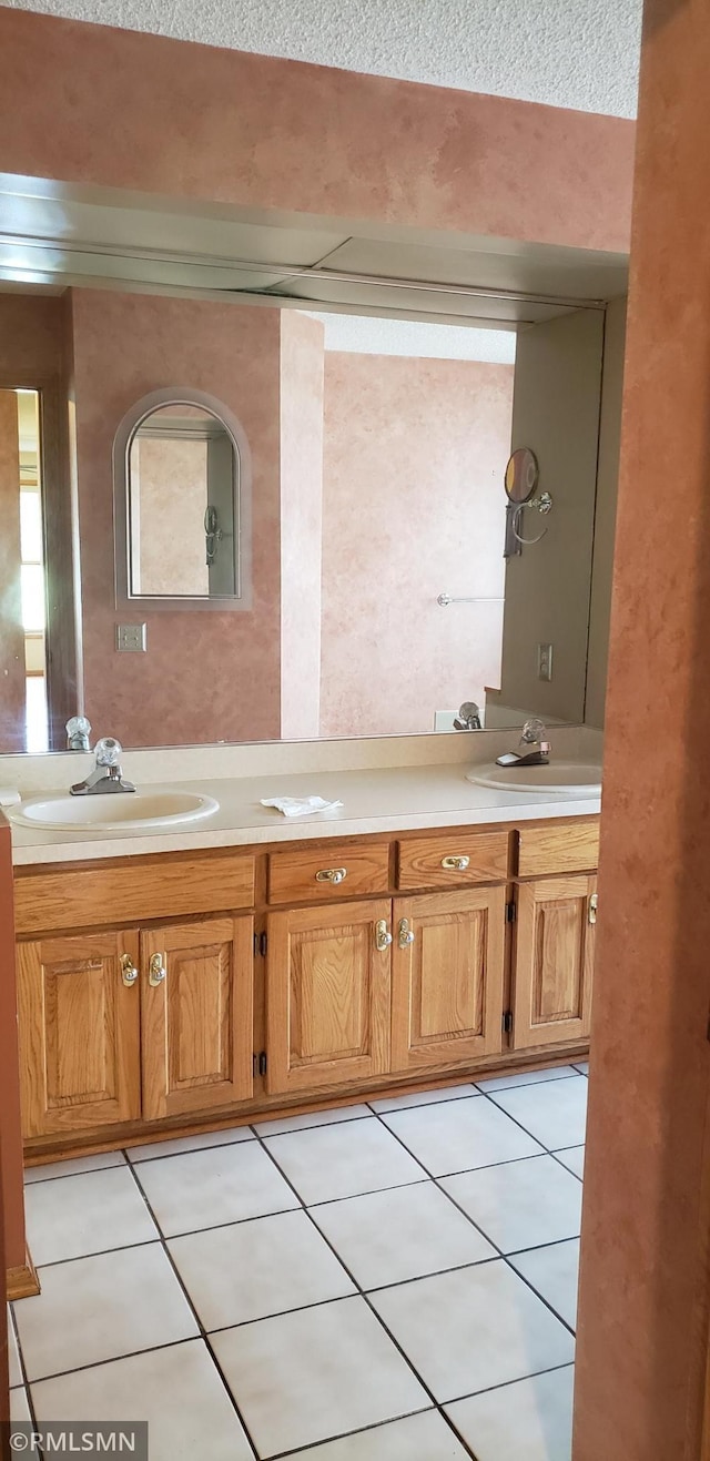 bathroom with vanity and tile patterned flooring