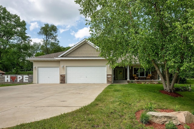 view of front of home with a garage and a front yard