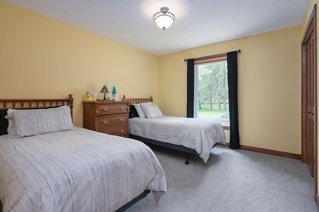 carpeted bedroom featuring a closet