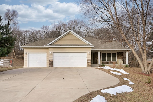 view of front of house featuring a porch and a garage