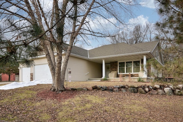 view of front of home with a garage and covered porch