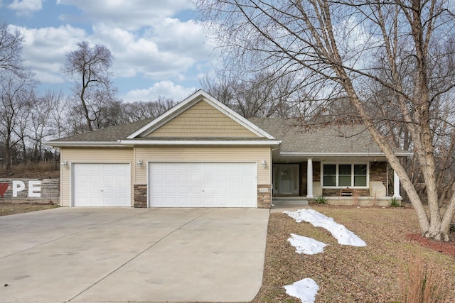 view of front of house with a porch and a garage