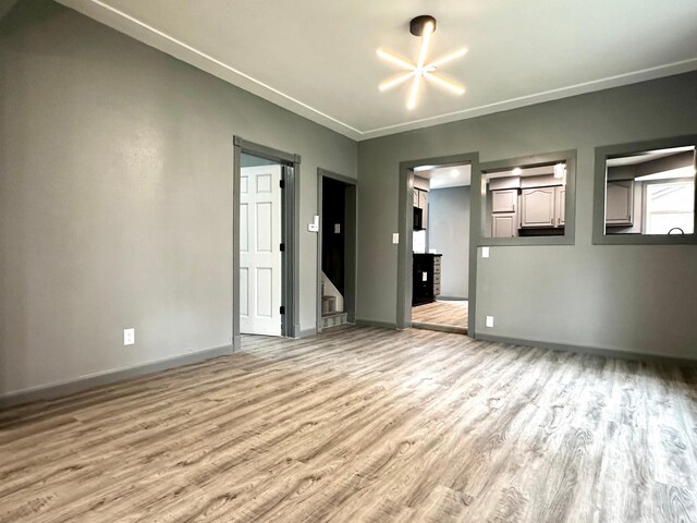 spare room with light hardwood / wood-style floors