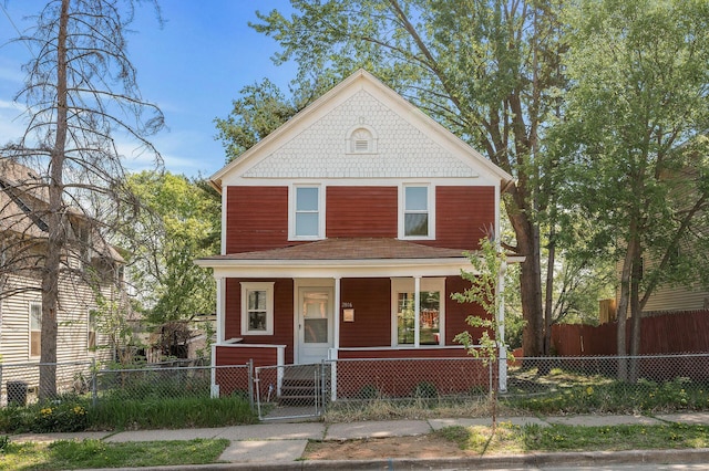 2806 Aldrich Ave N, Minneapolis, MN 55411 - view of front of property featuring covered porch, a gate, and a fenced front yard