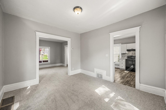 2806 Aldrich Ave N, Minneapolis, MN 55411 - carpeted spare room featuring baseboards