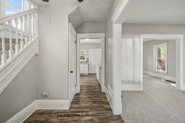 2806 Aldrich Ave N, Minneapolis, MN 55411 - hall with baseboards, healthy amount of natural light, dark wood-type flooring, stairs, and a textured ceiling