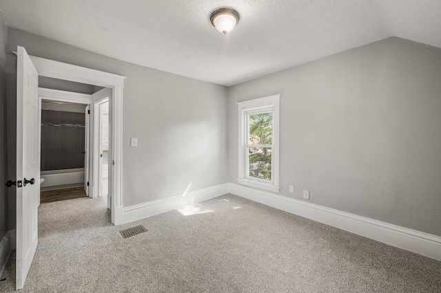 2806 Aldrich Ave N, Minneapolis, MN 55411 - unfurnished bedroom featuring carpet floors, baseboards, and a textured ceiling