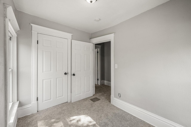 2806 Aldrich Ave N, Minneapolis, MN 55411 - unfurnished bedroom with carpet, baseboards, and a closet