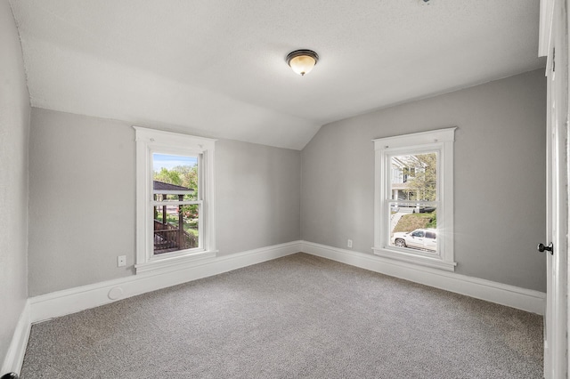 2806 Aldrich Ave N, Minneapolis, MN 55411 - bonus room featuring vaulted ceiling, carpet flooring, and baseboards
