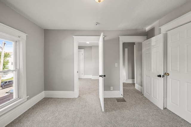 2806 Aldrich Ave N, Minneapolis, MN 55411 - unfurnished bedroom with carpet flooring and baseboards