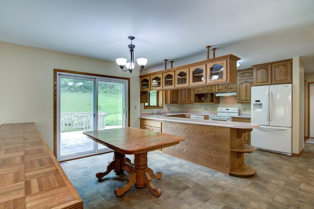 kitchen featuring white appliances, an inviting chandelier, sink, pendant lighting, and light tile patterned flooring