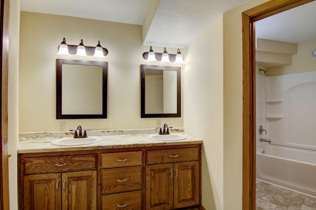 bathroom featuring tile patterned floors, double sink vanity, and tub / shower combination