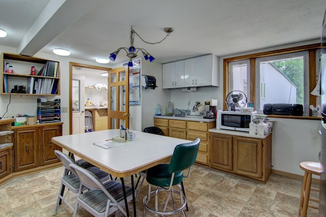 kitchen featuring sink and light tile patterned floors