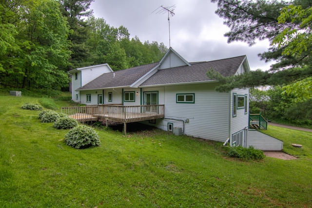 rear view of house with a yard