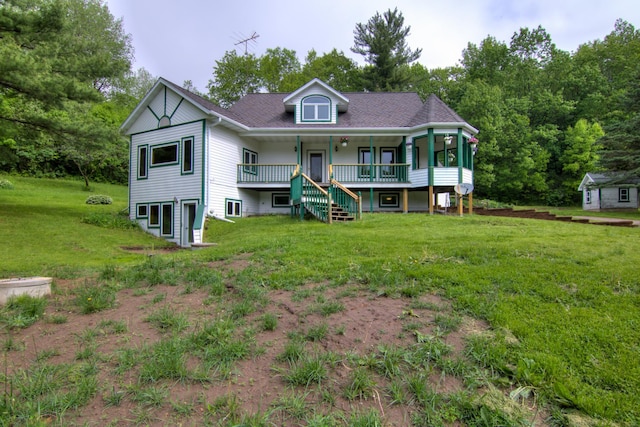 view of front facade with covered porch and a front lawn