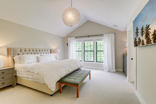 bedroom featuring carpet floors and lofted ceiling