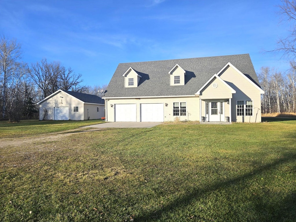 cape cod home with a front yard