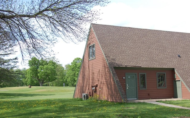 view of property exterior featuring a lawn