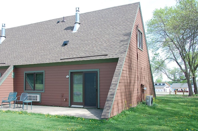 back of property featuring a lawn and a patio area