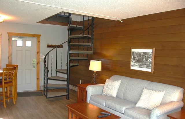 25124 Tame Fish Lake Rd Unit 550, Deerwood, MN 56444 - living area with stairway, a textured ceiling, wood walls, and wood finished floors