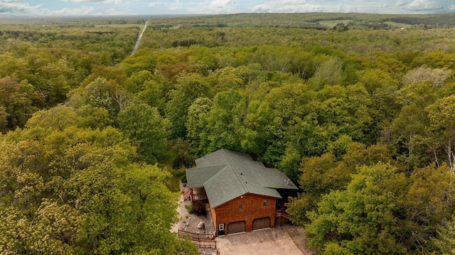 drone / aerial view featuring a forest view