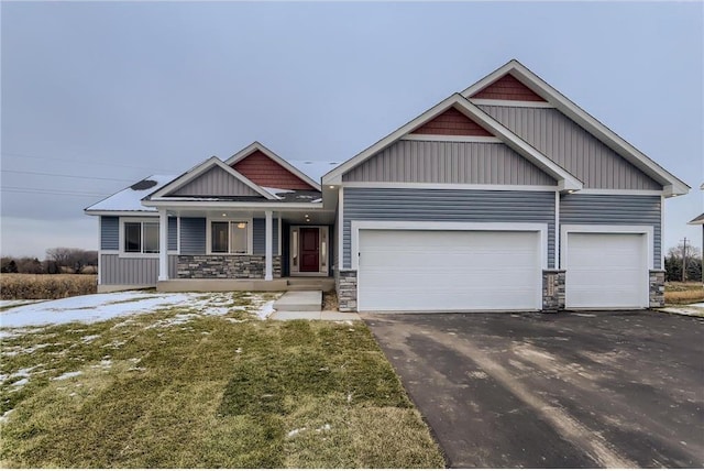 craftsman house featuring covered porch and a garage